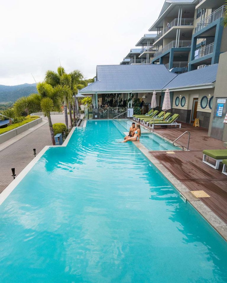 Couple lounging in the pool at Club Wyndham Airlie Beach