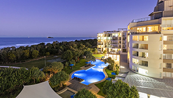 Top view of Ramada Marcoola resort, pool, and ocean.